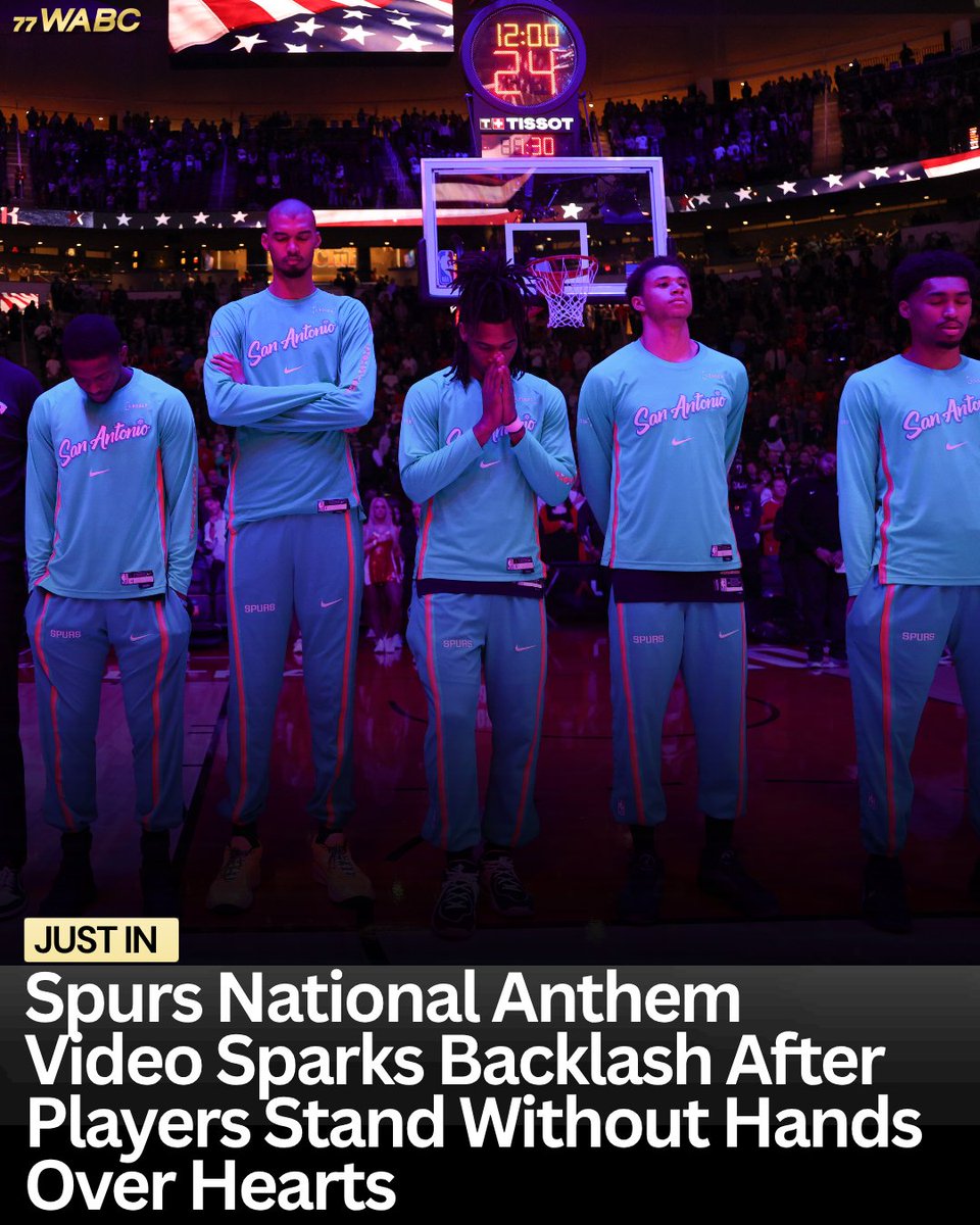 77WABCradio's tweet photo. The Spurs are facing backlash after a viral national anthem clip showed most players standing without their hands over their hearts.

Only two players appeared to cover their hearts, while Victor Wembanyama was seen standing with his arms crossed, sparking criticism from fans who say the moment showed a lack of respect during the anthem.

Photo via Ruters