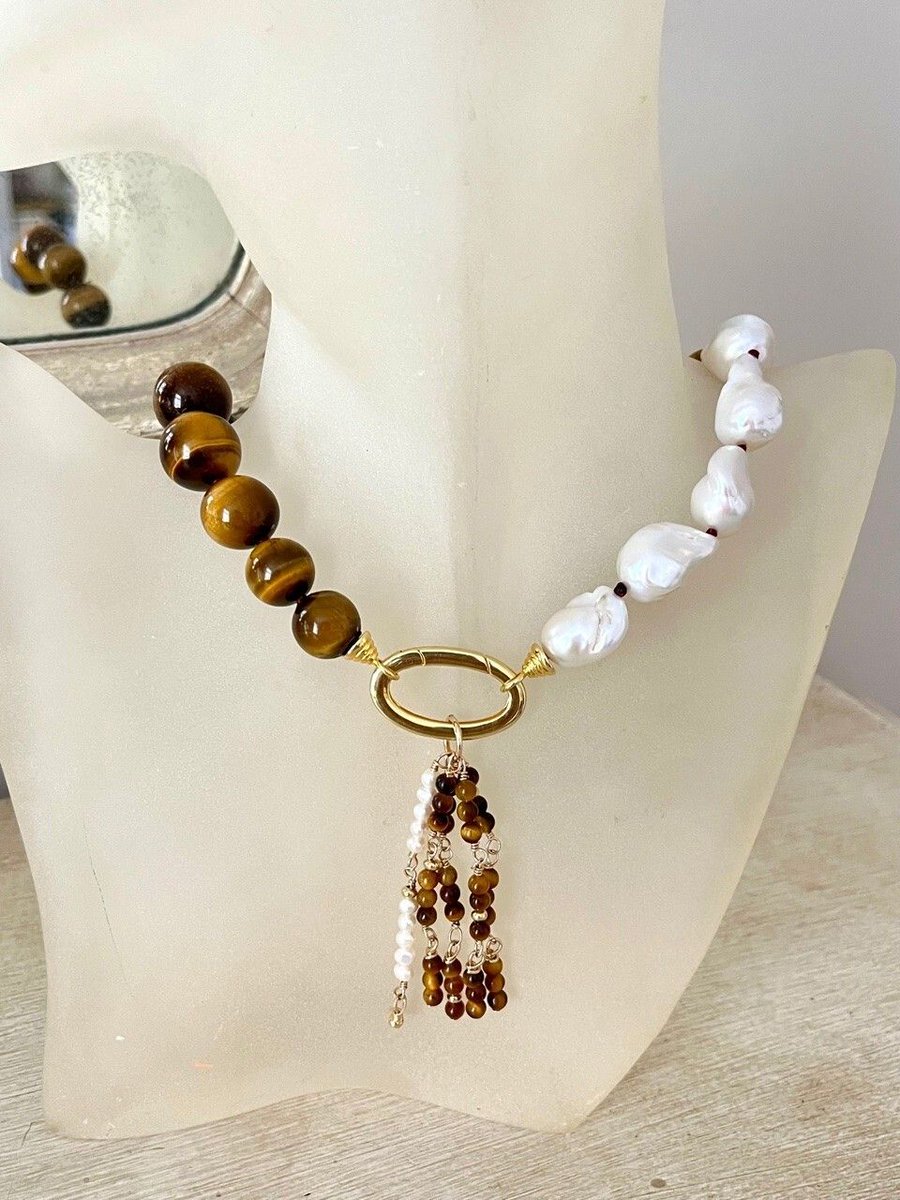 KidsforKids's tweet photo. ✨ AUCTION OPEN ✨

This stunning Tiger's Eye &amp; Baroque Pearl Necklace was created by Ambersouk exclusively to honour 25 years of @KidsforKids 💛

One of a kind. For an incredible cause 🙏

Bid now 👇
https://t.co/z8P5BONCoa 

#KidsForKids #CharityAuction #Ambersouk #Jewellery https://t.co/FYBNtcG76o