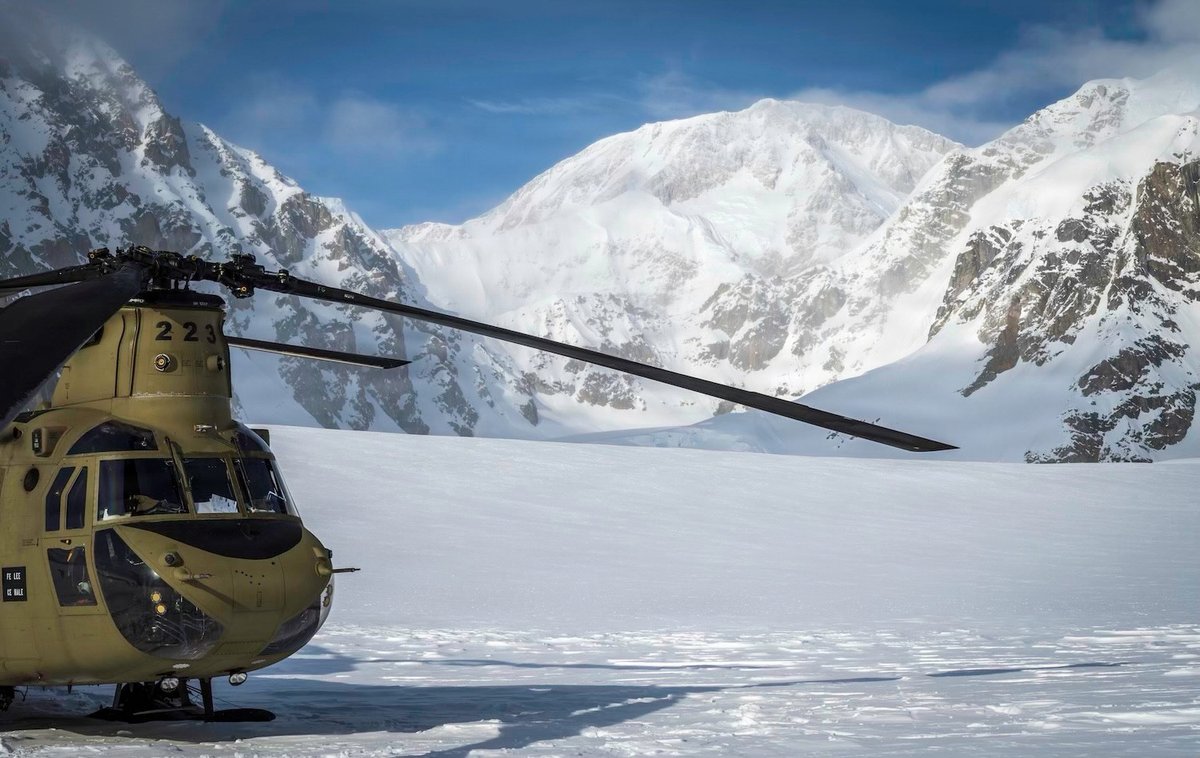 Army_Aviation's tweet photo. A CH-47F Chinook assigned to 1-52 GSAB rests on the Kahiltna Glacier with Denali in the background on April 14, 2025. Photo courtesy of DVIDS. https://t.co/DOyqa0J5Pl