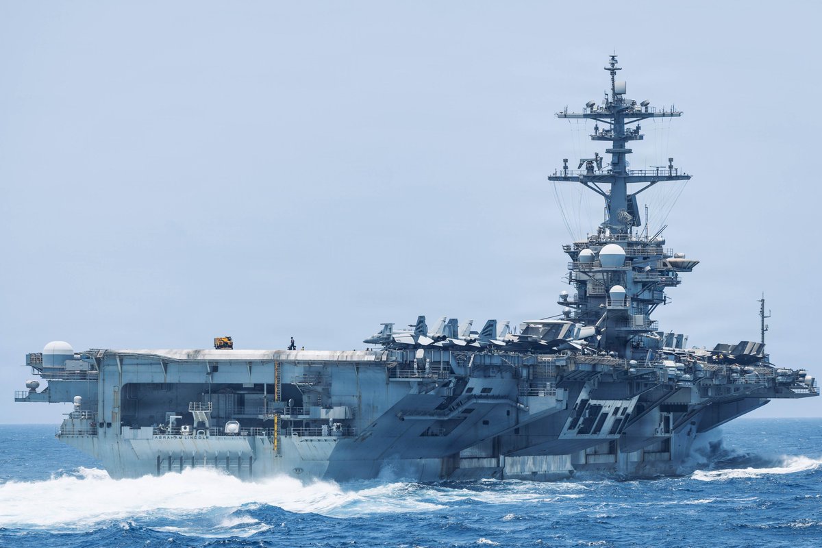 CENTCOM's tweet photo. USS Abraham Lincoln (CVN 72) transits the Arabian Sea as the aircraft carrier continues to support the U.S. blockade against Iran. U.S. forces have redirected 122 commercial vessels to ensure compliance.