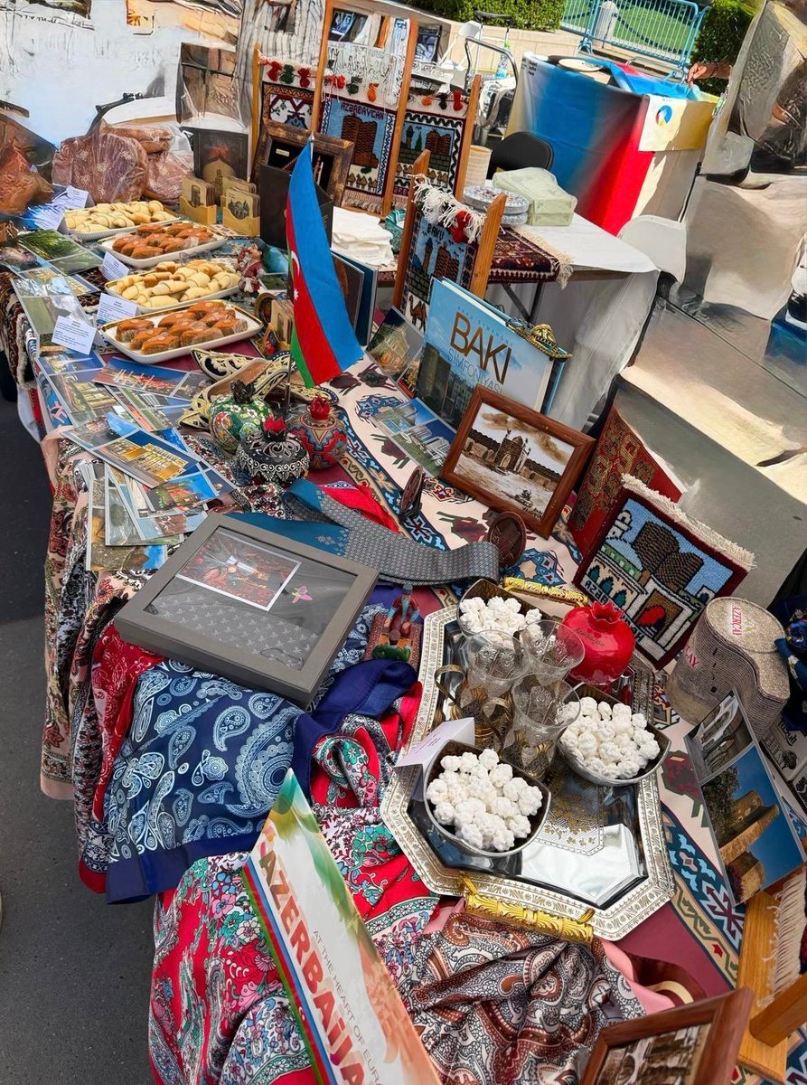 AzmissionUN's tweet photo. The Permanent Mission of the Republic of Azerbaijan to the United Nations proudly participated in the UN International Bazaar on 2 June 2026, showcasing the country’s rich cultural heritage and offering a delightful selection of traditional Azerbaijani sweets.

We were particularly honored to welcome the UN Deputy Secretary-General, H.E. Ms. Amina J. Mohammed, to our table.

The International Bazaar is a longstanding tradition that celebrates the rich cultural diversity of the UN community while raising funds for humanitarian causes around the world. This year’s proceeds will support the UN Office for the Coordination of Humanitarian Affairs (OCHA) and efforts to advance the UN Sustainable Development Goals.