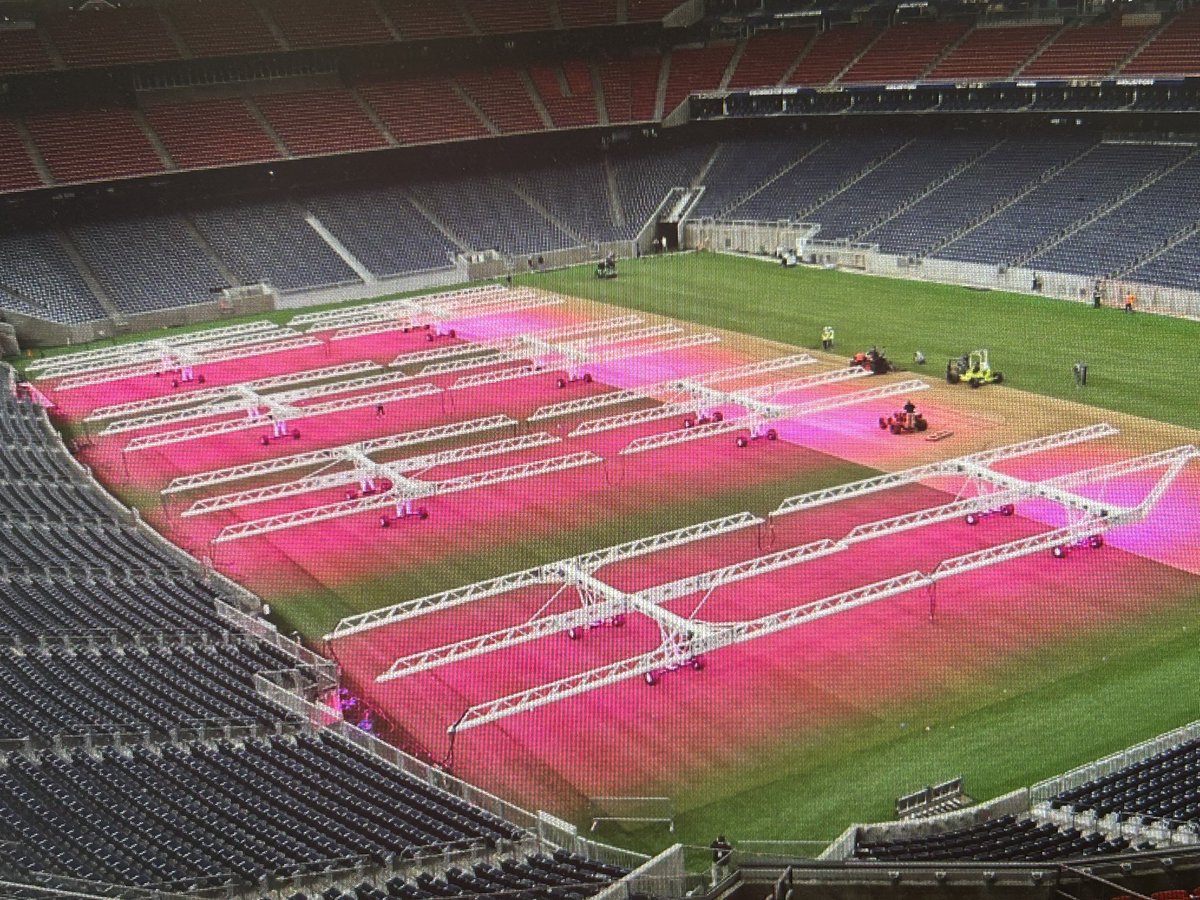 BillBishopKHOU's tweet photo. FIRST LOOK!  Real green grass growing inside Houston (NRG) Stadium for FIFA World Cup 2026.  The grow lights make that pink glow.  Photo credit:  FIFA World Cup 2026 Host Committee. https://t.co/SM1yRvWt7P
