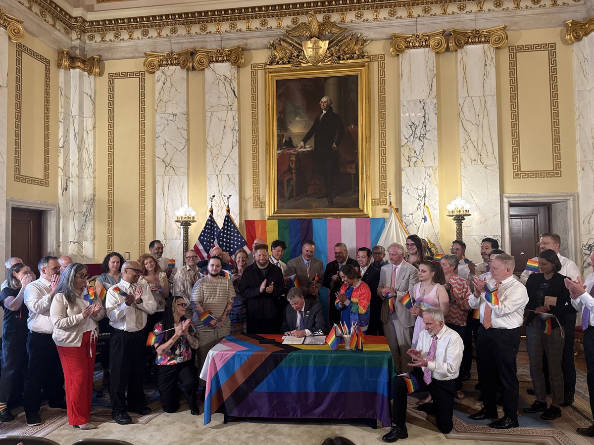 RISecState's tweet photo. Happy Pride Month, Rhode Island! 
Today, Secretary Amore joined the Governor in the State Room for the signing of a proclamation recognizing June as Pride Month. We're proud to support our LGBTQIA+ neighbors and are happy to celebrate their contributions to our state. https://t.co/cdaAPsmKyI