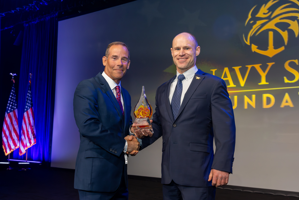 NavySEALfnd's tweet photo. Our 2026 NYC Benefit raised over $7 million for the warriors, veterans, and families of Naval Special Warfare. More than 1,100 guests showed up on April 23 for our biggest night of the year. 🇺🇸

We honored Paralympian and veteran Navy SEAL Dan Cnossen as our 2026 Fire in the Gut Honoree, and welcomed keynote speaker General (Ret.) Bryan P. Fenton, 13th Commander of USSOCOM.

Thank you to everyone who made this night possible. Every dollar fuels our programs in health, education, family well-being, and legacy care.