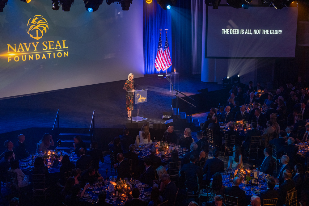 NavySEALfnd's tweet photo. Our 2026 NYC Benefit raised over $7 million for the warriors, veterans, and families of Naval Special Warfare. More than 1,100 guests showed up on April 23 for our biggest night of the year. 🇺🇸

We honored Paralympian and veteran Navy SEAL Dan Cnossen as our 2026 Fire in the Gut Honoree, and welcomed keynote speaker General (Ret.) Bryan P. Fenton, 13th Commander of USSOCOM.

Thank you to everyone who made this night possible. Every dollar fuels our programs in health, education, family well-being, and legacy care.