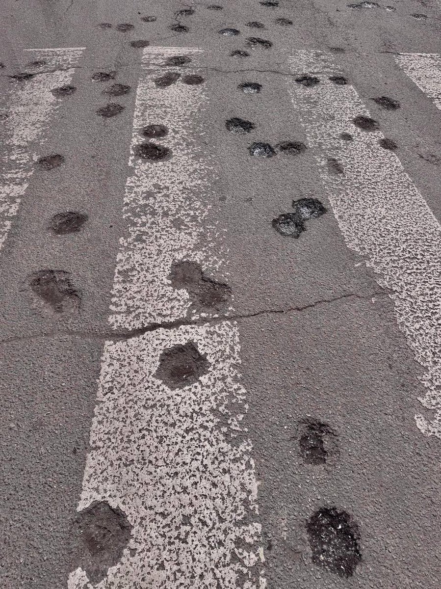 Klitschko's tweet photo. Look at this photo. This is a regular pedestrian crossing in a residential neighborhood of Dnipro, shredded by russian cluster munitions. This weapon is designed solely to kill and maim civilians.

Last night, russia launched a massive, coordinated strike across Ukraine, firing missiles and drones. Kyiv, Dnipro, Kharkiv, Zaporizhzhia, Sumy — the enemy targeted people in their sleep nationwide. And as I write these words, Dnipro is under attack again.

At least 21 people were killed and over 120 injured. In Dnipro alone, 15 people lost their lives, including a toddler. In Kyiv, 7 are dead. These numbers are still rising as rescuers clear the rubble.

This is a deliberate genocide of Ukrainians. The world cannot just watch this happen night after night, day after day.

We don't need expressions of deep concern. We need immediate, decisive action. Every delay in supplying weapons and air defense translates into more blood on Ukrainian streets. Sanctions must completely paralyze the russian military machine now.

The terrorist must be stopped. Force is the only language they understand.