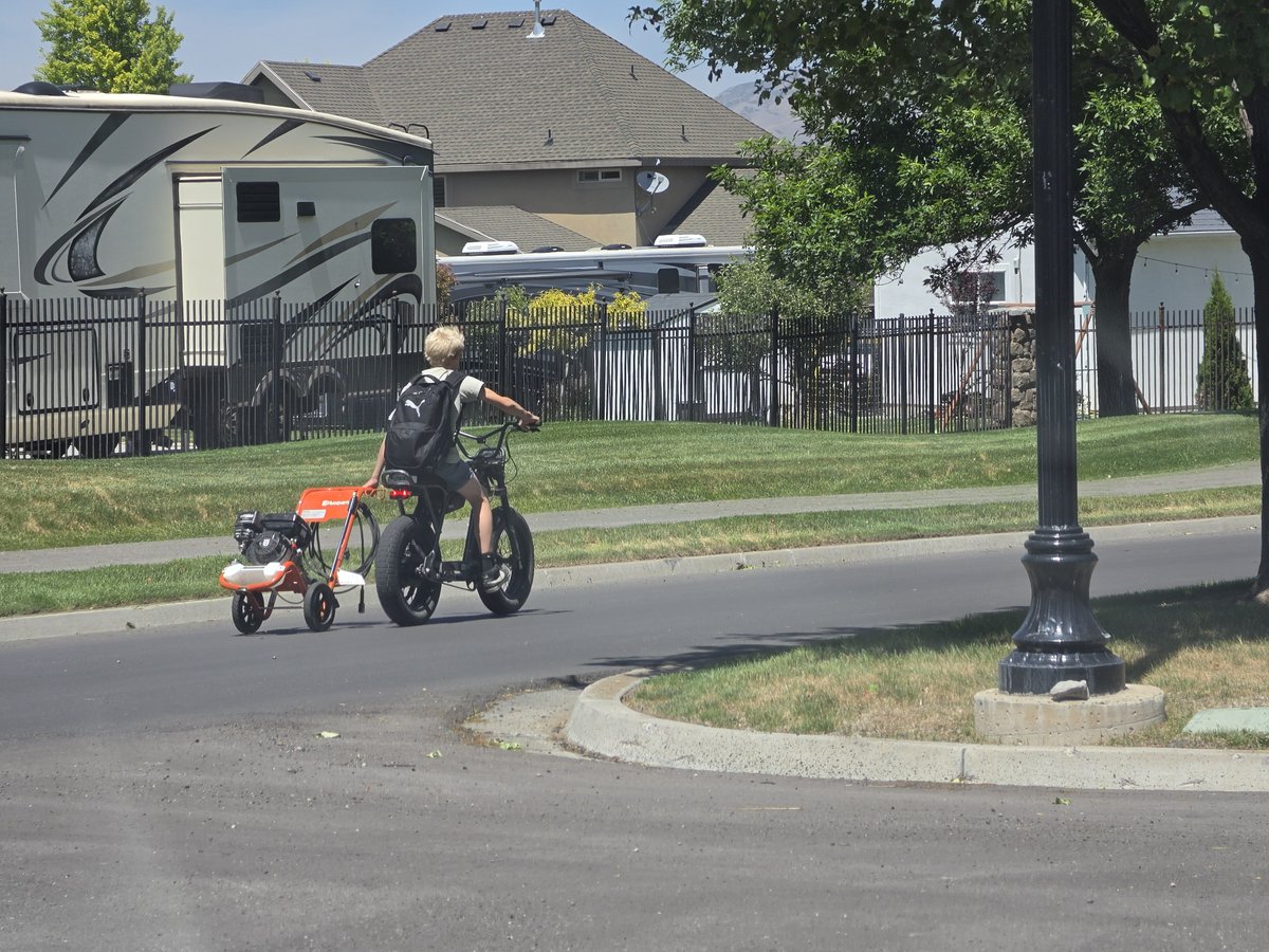 FiredUpCoug's tweet photo. Just drove past this kid in my neighborhood towing a pressure washer behind his bicycle, on his way to earn some summer money.

Love to see it. https://t.co/UYmXCSBB1t
