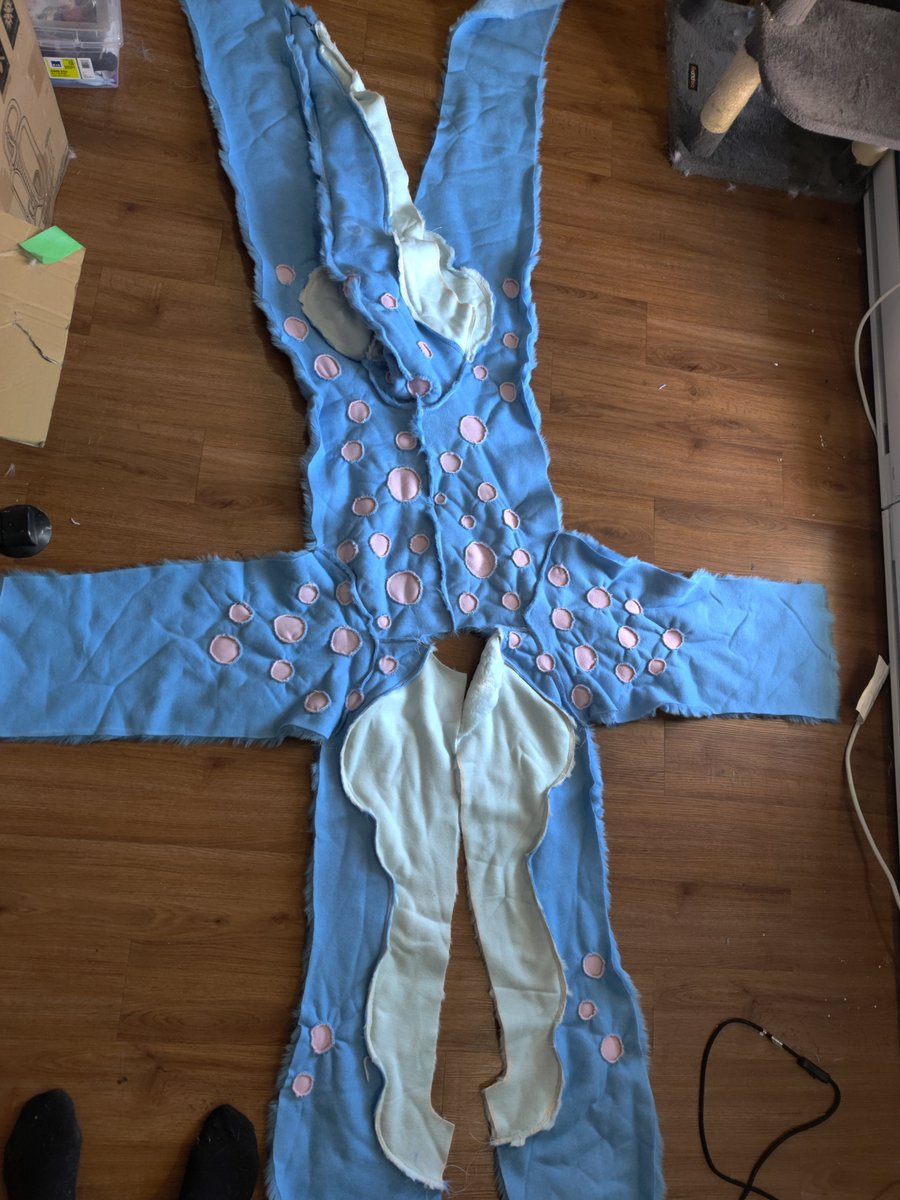 NobleGalactic's tweet photo. I am done sewing all the spots in for the dragon fur body suit (yes every one of those spots have to be hand sewn in). Next to be done on it is the muscles and chest fur tuff. and then i can sew both halves together.  ^_^ https://t.co/ugaZMvJ6Jl
