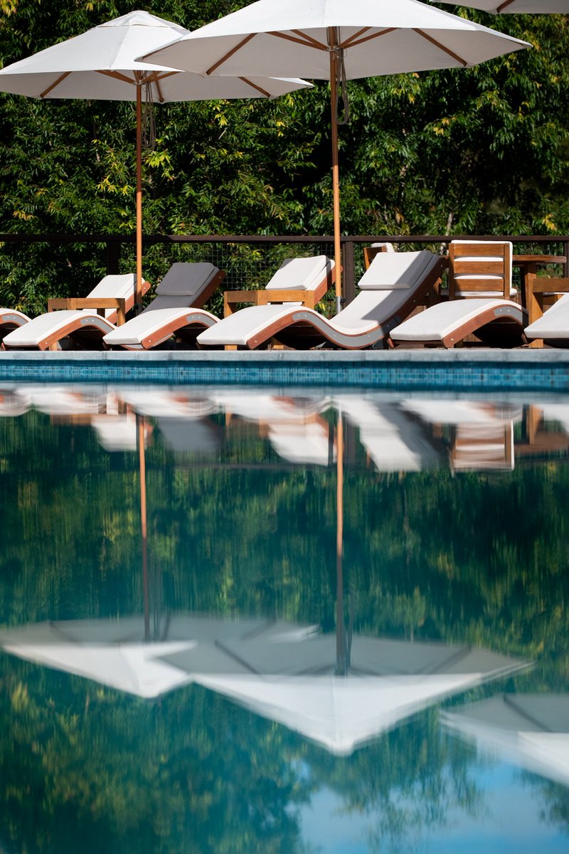 CrocHunterLodge's tweet photo. Sippin’, loungin’, and livin’ the wild life! 🍹 Poolside vibes meet outback style at the Crocodile Hunter Lodge. Who needs a beach when you’ve got The Billabong? Heated to perfection year round! ☀️ https://t.co/BQaRJRwlfy