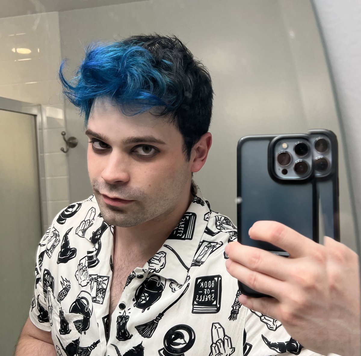 everydamien's tweet photo. Continuing pride month celebrations with a picture where he's giving blue hair and pronouns a little bit https://t.co/CccuN5yu6Z