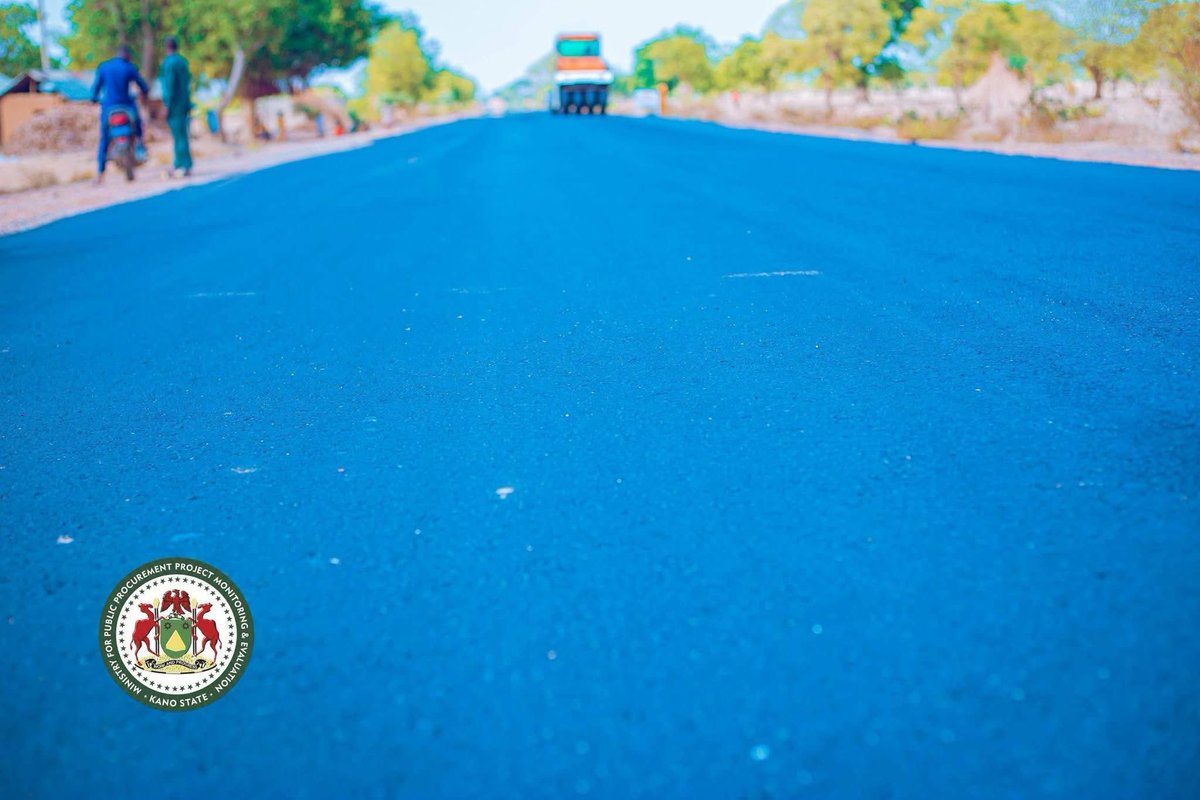 KanoFirstMedia's tweet photo. The ongoing asphalt laying on the 100km Madobi, Yako to Kwanar Dangora road is progressing as expected.

#KanoFirst https://t.co/p0lOUY6AI5