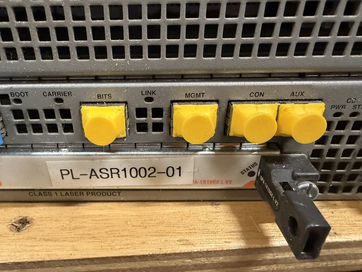 j2sw's tweet photo. Some 3d printed Ethernet covers in a Cisco router. https://t.co/kE0HGAaYLe