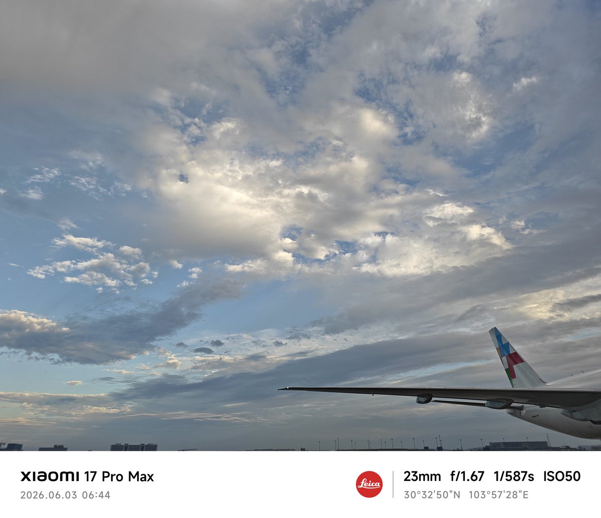 BD8CBU's tweet photo. After the rain, the sky opened up — blue, bright, and full of light. In the distance, the snow-capped mountain glowed like gold under the morning sun, while the wet runway reflected the clouds and aircraft. https://t.co/SRdM1A15tG