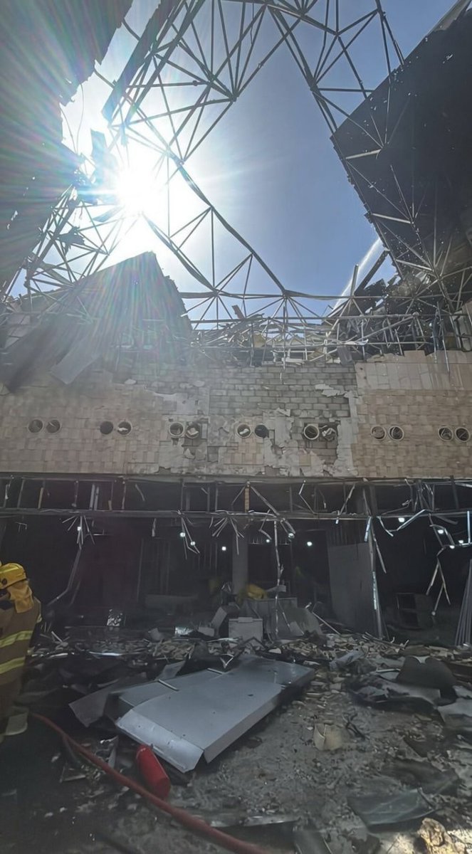 Intlnow's tweet photo. Breaking: Kuwait's civil aviation authority verified that Iranian drones and missiles struck the T1 terminal at Kuwait International Airport. Multiple individuals were injured, and the structure suffered extensive damage. https://t.co/J49G2J5SoH