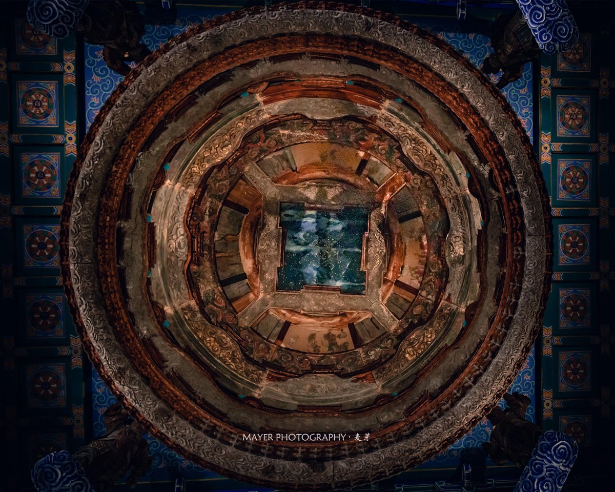 SceneryCHN's tweet photo. Look up.

These are Zaojing (藻井), ornate caisson ceilings found in the most sacred spaces of traditional Chinese architecture.

Placed above emperors, deities, and ceremonial halls, they were designed as miniature visions of heaven itself.

This celebrated example from Beijing's Xiannongtan rises through six intricate tiers of miniature pavilions, clouds, celestial beings, and heavenly architecture. 

A ceiling, perhaps.

Or a Chinese way of looking at the universe.