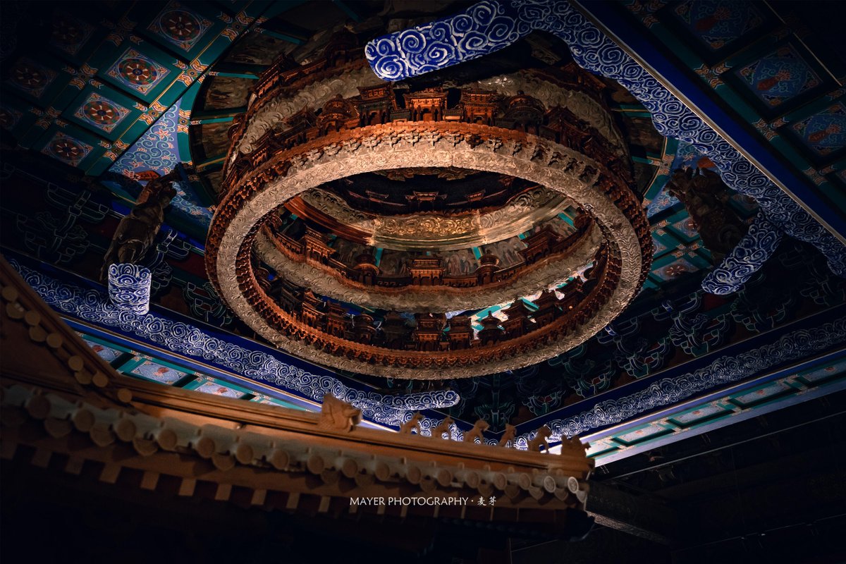 SceneryCHN's tweet photo. Look up.

These are Zaojing (藻井), ornate caisson ceilings found in the most sacred spaces of traditional Chinese architecture.

Placed above emperors, deities, and ceremonial halls, they were designed as miniature visions of heaven itself.

This celebrated example from Beijing's Xiannongtan rises through six intricate tiers of miniature pavilions, clouds, celestial beings, and heavenly architecture. 

A ceiling, perhaps.

Or a Chinese way of looking at the universe.