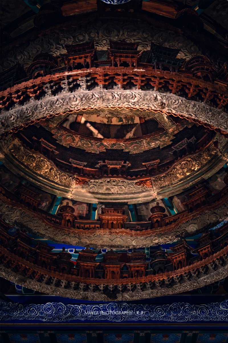 SceneryCHN's tweet photo. Look up.

These are Zaojing (藻井), ornate caisson ceilings found in the most sacred spaces of traditional Chinese architecture.

Placed above emperors, deities, and ceremonial halls, they were designed as miniature visions of heaven itself.

This celebrated example from Beijing's Xiannongtan rises through six intricate tiers of miniature pavilions, clouds, celestial beings, and heavenly architecture. 

A ceiling, perhaps.

Or a Chinese way of looking at the universe.