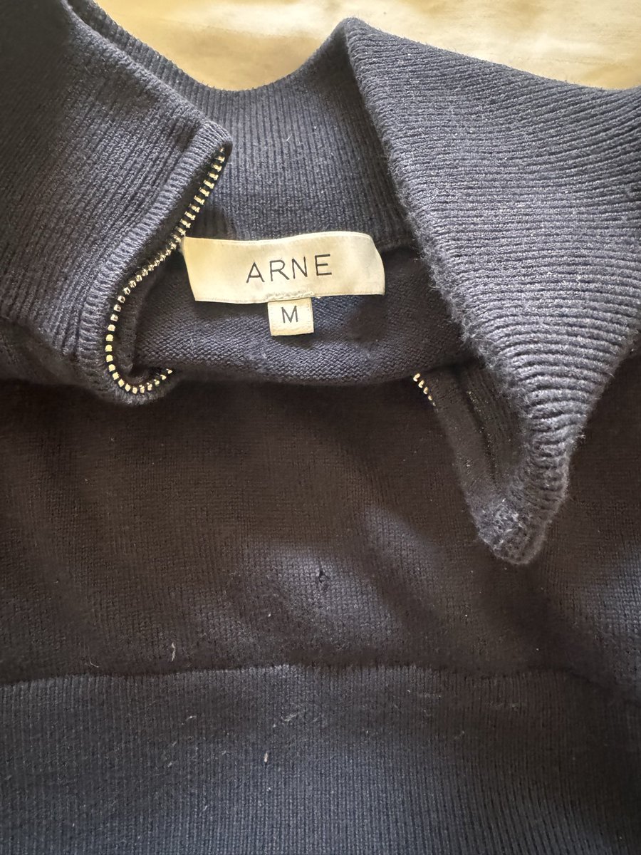 ConsumerAction0's tweet photo. @Arneclo rubbish quality, got this quarter zip for Christmas 2025, worn twice, fabric already coming apart! Rather than just take a look at it (it’s clearly their product) they want a receipt. It was a gift and I don’t have one! #rubbish https://t.co/H0AR7HHubA