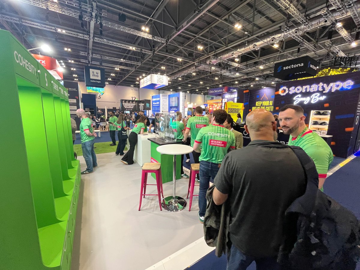 Cohesity's tweet photo. Other booths. Then there's us. 🐐💚
🐐 G.O.A.T. level cyber resilience demos
🎮 VR experience on the floor
👟 Full locker room booth energy
👀 Data security experts ready to talk

Stand D160 through Thursday. Come say 👋 #InfoSecEurope https://t.co/Th1XyHviTb