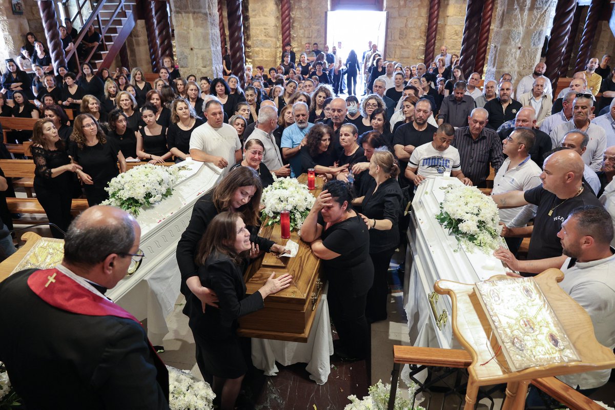 AJEnglish's tweet photo. Photos: Relatives mourn loved ones killed in Israeli attack on Lebanon 

🔴 LIVE updates: https://t.co/ejKzTcs9VG https://t.co/zE3C0LN5em