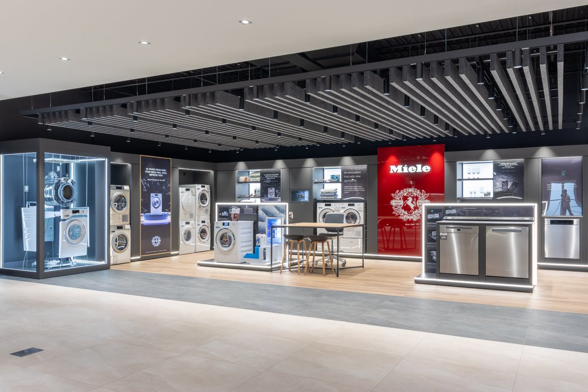 altispace's tweet photo. We're excited to share this stunning Caplan’s Miele Showroom, featuring our Acoustic Blades in Charcoal Gray, suspended throughout the space using the Unistrut method for a clean, contemporary look! 🤩 

#altispace #retailinterior #retaildesign #acousticbaffles #baffles https://t.co/EqBB8kBurf