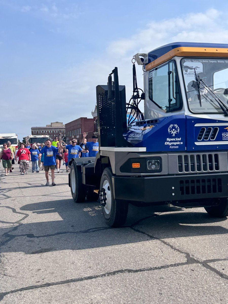 ottawapd's tweet photo. KLETR is here!  Thanks for lining Main Street as the athletes were the First to Carry the Torch through Downtown Ottawa. Officers will carry the torch to BETO Junction and meet officers from Lyon County to end our section.  Torch arrives in Wichita this weekend for summer games. https://t.co/o3LlwgZ8cl