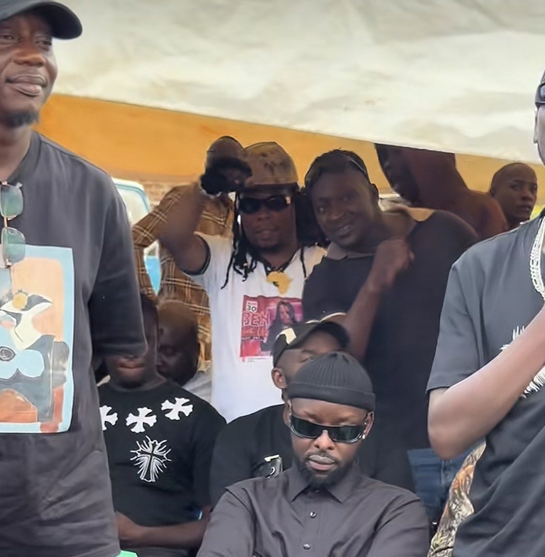 kirya_ug's tweet photo. BET winner and also Uganda National Musicians Federation president Eddy Kenzo refuses to stand up during the singing of “Tuliyambala Engule” song at the burial of Master Parrot. Kenzo is against the message in this song. https://t.co/oMJdfjAZmH