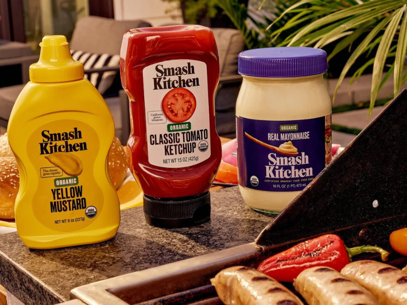 cpgwire's tweet photo. According to a report from Inc. Magazine, Smash Kitchen is set to surpass $100M in annual retail sales by the end of 2026.

Founded by Sameer Mehta, Sean Kane, and Glen Powell, Smash Kitchen made its debut at Walmart last April with a line of clean condiments.

Since then, the company has expanded into several other categories and launched in nearly 15,000 doors across the U.S.