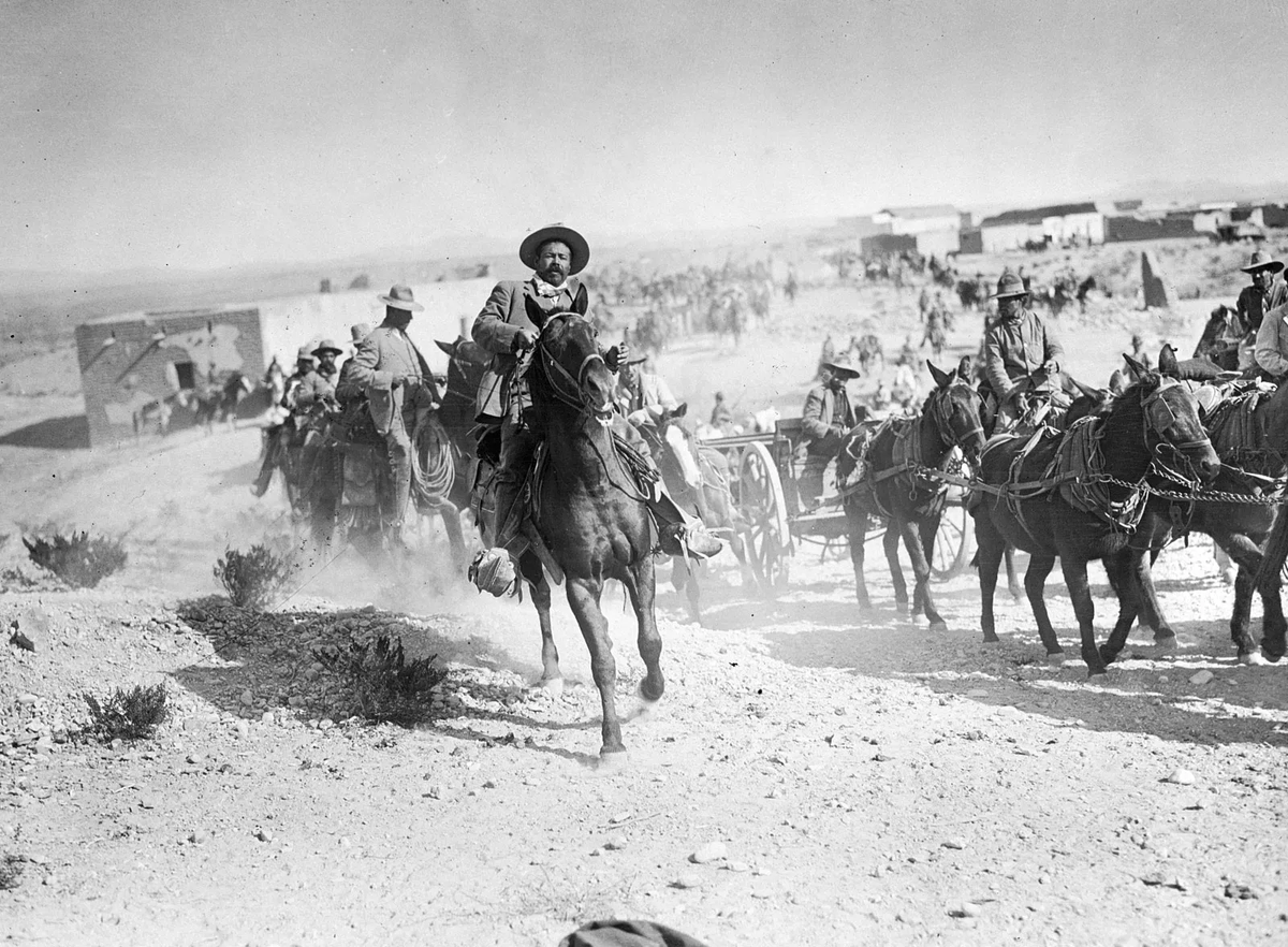 EchoesofWarYT's tweet photo. On March 9, 1916, Pancho Villa crossed the border and raided Columbus, New Mexico. His men burned the town and killed 18 Americans. It was the first armed invasion of the US mainland in over a century.

America's response exposed a humiliating secret.

The United States, an industrial giant about to inherit the 20th century, had an army of barely 100,000 men. Smaller than Portugal's. Wilson sent 10,000 troops under General Pershing into Mexico to hunt Villa, and the expedition revealed an army with broken logistics, obsolete equipment and almost no trained officers.

They chased Villa for 11 months. They never caught him.

(One bright spot: a young lieutenant named George S. Patton ran down three of Villa's men in a shootout and drove back to camp with the bodies strapped to the hood of his car. Pershing called him his "bandit." Remember the name.)

Congress panicked, and on June 3, 1916, Wilson signed the National Defense Act. It more than doubled the authorized Army, federalized the National Guard as the nation's permanent reserve, and created a brand new program for training college kids to be officers.

They called it the Reserve Officers' Training Corps. ROTC.

Ten months later, America entered World War I and needed officers by the tens of thousands. The timing was almost absurd.

Since that day, ROTC has commissioned over 600,000 officers. Seven Army chiefs of staff. Two chairmen of the Joint Chiefs. Cabinet secretaries. A Supreme Court justice. Colin Powell came out of CCNY's program.

So here's the chain of events: one Mexican revolutionary raided one border town, embarrassed one unprepared army, and accidentally created the machine that has produced American military leadership for 110 years.