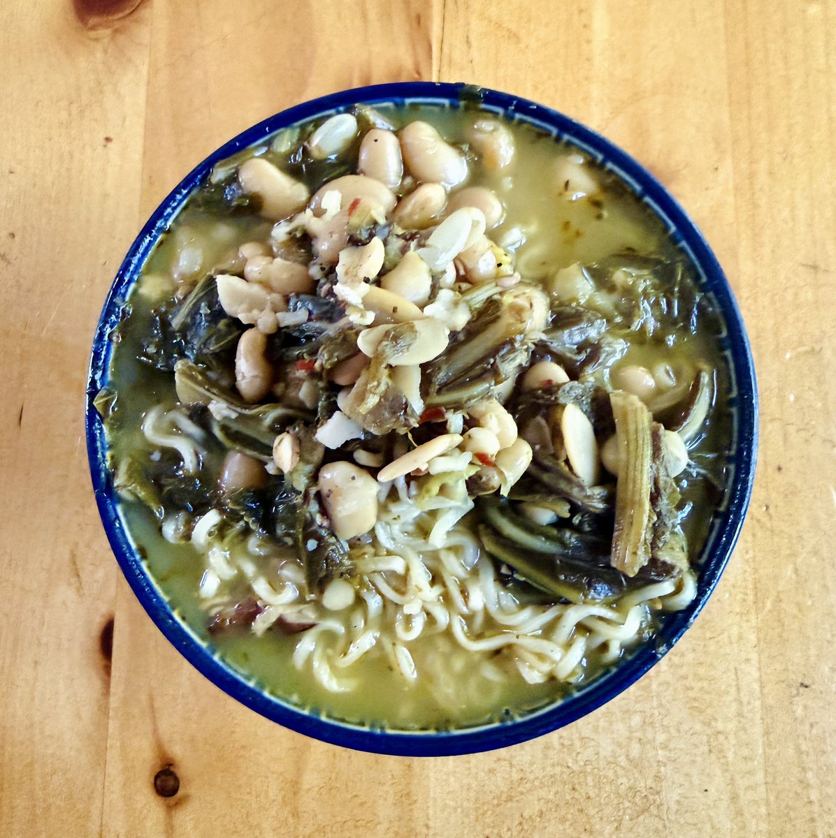 SupernovaMomma's tweet photo. My safe food this week is butter bean and mixed green ramen. I’ve eaten it for lunch and dinner every day.  Yes. I know I’m a country ass Autistic Black woman https://t.co/agAtr5FrIm