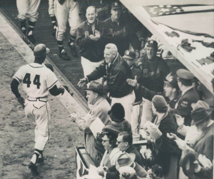 baseballinpix's tweet photo. Hank Aaron going back to the dugout after hitting a home run in game four of the 1957 World Series. He hit .393 with 7 home runs throughout the series. https://t.co/7nIDJ2G8WD