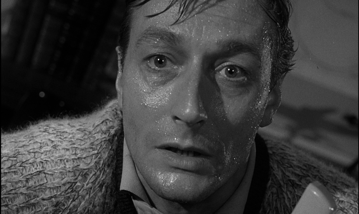 DVDBeaver's tweet photo. John Krish's "Unearthly Stranger" Blu-ray - John Neville, Philip Stone, Patrick Newell, Gabriella Licudi, Warren Mitchell, Jean Marsh @KinoLorber
US: https://t.co/yOsC0ig8WT
CAN: https://t.co/5Y4LStQPPW
BONUS CAPTURES:
https://t.co/pLwIeYZKDE
OUR COMPARISON:
https://t.co/qzGdMxYACt
A cleverly conceived, eerily atmospheric sci-fi chiller, Unearthly Stranger stars John Neville (The Adventures of Baron Munchausen) as a scientist engaged in an experimental project like no other. TP91 is a secret and highly complex formula which will enable man to project himself through time and space, but when Dr. Munro (Warren Mitchell, Jabberwocky) succeeds in solving the first part of it he is found dead before he can pass on the invaluable result. His successor (Neville) quickly senses that both he and his new wife (Gabriella Licudi, Casino Royale) are now in grave danger. This original, intelligent and compelling thriller was directed by John Krish (Decline and Fall… of a Birdwatcher) and featured Philip Stone (The Shining), Patrick Newell (The Avengers) and Jean Marsh (Willow) in wonderful supporting roles.
***
John Krish’s Unearthly Stranger is a lean, dialogue-driven British science-fiction thriller that punches far above its modest B-movie weight. It exemplifies the intelligent, low-budget strain of 1960s British genre cinema that favored paranoia, atmosphere, and social subtext over special effects or spectacle. As Krish’s first theatrical feature (he came from documentary and later contributed to The Avengers,) the film demonstrates remarkable economy and visual ingenuity within severe constraints - few locations, minimal cast, and virtually no optical effects. What emerges is a chamber-piece study of distrust, otherness, and quiet invasion that still feels unsettling today. Everyday details, such as Julie removing a hot casserole dish from the oven bare-handed, land with quiet horror because they are played completely straight. The cast elevates the material significantly. John Neville (The Adventures of Baron Munchausen, A Study in Terror, Billy Budd) brings a convincing mix of intellectual intensity and emotional unraveling to Davidson; his growing hysteria never tips into camp. Gabriella Licudi (Casino Royale, The Fall of the Roman Empire,) often cast as exotic “decoration,” here delivers a genuinely enigmatic and poignant performance as the alien who begins to question her mission through human connection. Patrick Newell’s (The Canterbury Tales, The Avengers, The Strange Affair, The Magnificent Seven Deadly Sins) Major Clarke is a standout - jovially sinister, bureaucratic, and faintly ridiculous in a way that makes the security state itself feel alienating. Philip Stone provides gravitas as the senior scientist, while Jean Marsh (The Changeling, The Eagle Has Landed, A Day in the Death of Joe Egg, Frenzy, The Roman Spring of Mrs. Stone, The Limping Man) makes the most of her limited screen time, her final reveal landing with real impact. The ensemble treats the pseudoscientific dialogue with straight-faced conviction, which is essential to the film’s effectiveness. Unearthly Stranger is frequently compared to I Married a Monster from Outer Space (1958) and Invasion of the Body Snatchers, but it is quieter, more intimate, and more socially pointed. Its greatest strength is its restraint and atmosphere. On a tiny budget it creates genuine unease without monsters or explosions. The final twist is genuinely chilling in its implications. Limitations include occasional plot holes (lax security for a project of this importance), heavy reliance on exposition, and some dated pseudoscience. Gender politics can feel uncomfortable to modern viewers - Julie is objectified and ultimately neutralized as a threat - though the film’s deeper critique of male institutions provides some counterbalance. Today it remains underrated, occasionally resurfacing in discussions of British B-movies and paranoid sci-fi. It was selected by film historians Steve Chibnall and Brian McFarlane as one of the most meritorious British B-films of 1945–1970. Its influence is subtle but visible in later low-key invasion narratives. This Kino Blu-ray release marks the first major U.S. edition of Unearthly Stranger and it bests the earlier region 'B' Network disc on every front. For fans of 1960s British sci-fi, paranoia thrillers, and understated genre cinema, this is a strong and long-overdue presentation that does justice to John Krish’s intelligent little chiller. Warmly recommended.