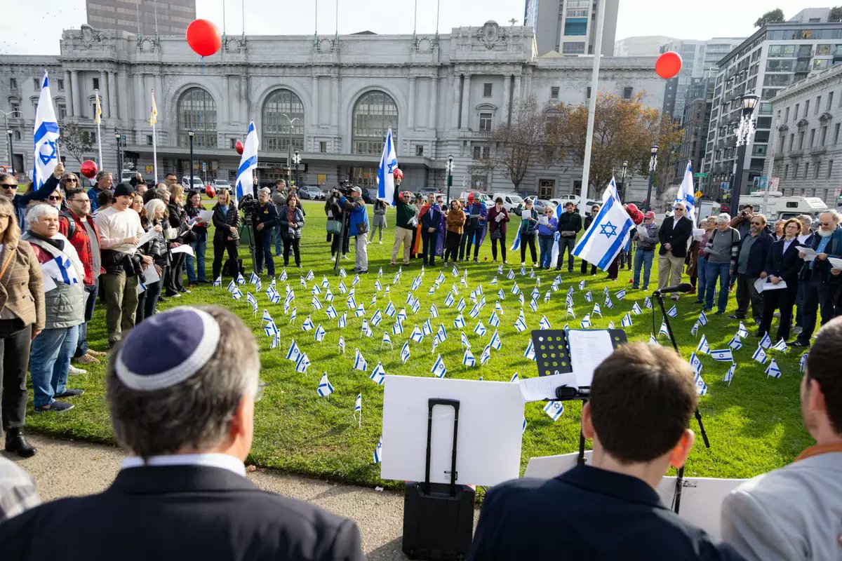 loomdoop's tweet photo. When Connie Chan was doing the Gaza ceasefire public comment in 2023, Scott Wiener was outside city hall planting Israeli flags on the lawn. 

And Track AIPAC is now trying to present him as a lesser evil. https://t.co/ccjjbtCpqO