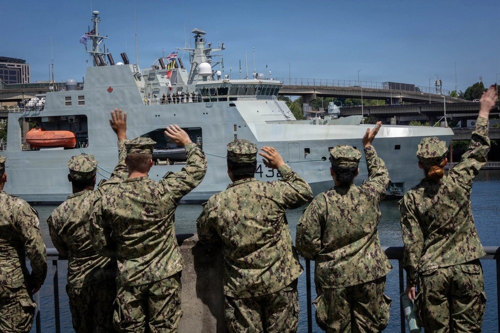 mapleleafnavy's tweet photo. U.S. Navy Sailors wave to the Harry DeWolf-class offshore patrol vessel HMCS Max Bernays (AOPV 432) arriving for Portland Fleet Week during the city's Rose Festival, June 2, 2026. (U.S. Navy photo by Mass Communication Specialist 3rd Class Joey Sitter) https://t.co/zZ8PNfWuTI