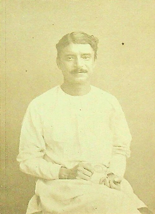 Fintech03's tweet photo. In the late 1890s, inside a bustling lab on Bowbazar Street in Calcutta, a young Indian medical student sat in total darkness, his eyes heavily bandaged after a horrific lab acid explosion had prematurely ended his medical career. Rather than surrendering to despair, he used his heightened sense of smell & sound to launch a parallel industrial empire, inventing a hair elixir so legendary that it birthed the 1st science-fiction story in the Bengali language & setting up a homemade recording studio that would capture the voices of the revolution before the West could patent them.  

The history of early Indian consumer enterprise has no character more cinematic than Hemendra Mohan Bose (popularly known as H. Bose). After his tragic accident forced him out of medical college, Bose pivoted entirely to organic chemistry & perfumery.  In 1894, he formulated Kuntaline Hair Oil, a brilliant, non-greasy, deeply aromatic hair elixir infused with pure natural extracts. But Bose was not just a chemist; he was perhaps the most brilliant, quirky & avant-garde marketing wizard independent India had ever seen.  

To sell his Swadeshi hair oil against deeply entrenched British competitors, Bose pulled off a masterstroke of product placement. He instituted the Kuntalin Puraskar (Kuntaline Awards), inviting writers from across the country to submit short stories. The prize money was massive, but there was 1 highly eccentric, genius catch: the narrative had to seamlessly feature Kuntaline Hair Oil/his Delkhosh perfume within the plot w/o making it look like an overt commercial.  

In 1896, an anonymous entry won the very first Kuntalin Puraskar. Titled Nirrudesher Kahini (Story of the Untraceable), it told the story of a terrifying cyclone bearing down to completely annihilate Calcutta. In a desperate bid to save his ship from the monstrous cyclonic waves, the hero remembers a scientific theory about oil smoothing out turbulent waters & dumps his massive cargo of Kuntaline Hair Oil into the ocean, instantly calming the sea & saving the city. 

The anonymous author who wrote this product-placed story? None other than the legendary physicist Sir Jagadish Chandra Bose, writing what is now recognized as the very 1st science-fiction story in the Bengali language. 

Later, a young, unknown writer named Sarat Chandra Chattopadhyay won the same award, launching his historic literary career.  But H. Bose's audacity went far beyond print. In 1900, he imported an early Edison Phonograph to privately record his friends. When British recording companies began charging extortionate prices to press records of Indian musicians, Bose weaponized his workshop. 

By 1907, he began manufacturing his own wax recording cylinders, launching H. Bose Swadeshi Records.  He manually captured & preserved the voices of India's intellectual titans. It was inside H. Bose’s studio that Rabindranath Tagore stood before a brass horn & recorded his very 1st rendition of Bande Mataram. When the British govt aggressively banned the public singing of nationalist anthems, Bose secretly duplicated his Swadeshi cylinders & distributed them across the country in boxes disguised as Kuntaline hair oil shipments.  

His son, Nitin Bose, trained in his father's improvised labs, went on to become the pioneering father of Indian cinema technique, inventing the concept of playback singing at New Theatres. Yet today, if we search through the modern digital music & cosmetics landscape, the name of the blind-struck chemist who recorded the soul of the revolution is entirely absent.  

The modern entertainment & beauty industries are driven by multi billion dollar streaming algos & synthetic grooming formulas backed by global corporate capital, yet every single time an artist steps up to a microphone to record a track of defiance/a writer creates a world out of raw imagination, the heavy, rhythmic ghost of H. Bose’s wax cylinders still spins in the dark proving that while a foreign empire can try to mute a nation, they can never stop the sound & scent of its freedom.