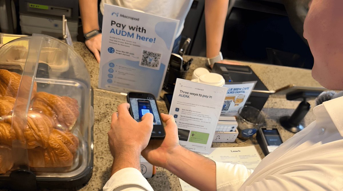 victorzh's tweet photo. AUDM @Macropod_AU retail payment went live in a Sydney café this week. Scan, pay, merchant has bankable AUD almost instantly.

The rail underneath isn't the token. @OpenPasskey settles stablecoin in 1 second on Base, 0% protocol fee, no card network in the path.

Same rail a person taps, an agent pays over x402/MPP. One settlement layer for human and machine money.