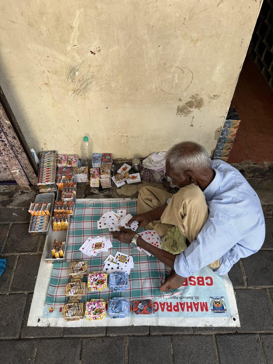 mumbaiheritage's tweet photo. Spotted at Dana Bunder, Mumbai.

This elderly gentleman spends his day sorting used playing cards by hand, matching suits and numbers before repacking them into complete decks for resale.

A glimpse into Mumbai’s hidden recycling economy, where even a deck of cards gets a second life.

Have you ever seen this trade elsewhere in the city?
#MumbaiHeritage #MumbaiStories