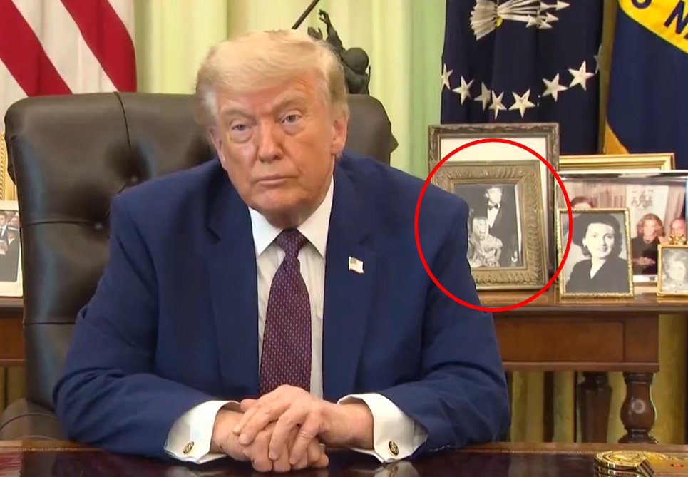 KeithEdward66's tweet photo. @mmpadellan Holy shit!

Has anyone noticed the photo on the desk behind him?

Why that particular photo, and why is it in black &amp; white when the original was color? https://t.co/WzL3AgV7nP
