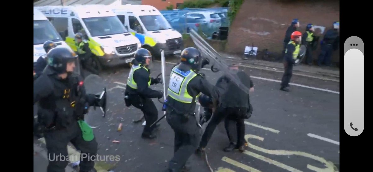 blobbers01's tweet photo. The following police officers need removing from front line duty for attempted murder.

1B used riot shield to attack back of the head caught on camera thats fucking disgusting.

1A6 caught on camera rabbit punching, this is fucking beyond sick. 

@HantsPolice your riot training is lacking, you force is dangerous out of control violent and not operating within the law.

Both these officers need suspending this morning with immediate effect.