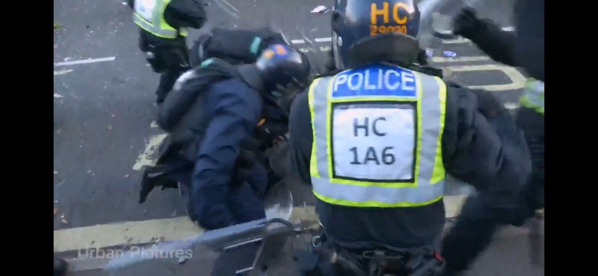 blobbers01's tweet photo. The following police officers need removing from front line duty for attempted murder.

1B used riot shield to attack back of the head caught on camera thats fucking disgusting.

1A6 caught on camera rabbit punching, this is fucking beyond sick. 

@HantsPolice your riot training is lacking, you force is dangerous out of control violent and not operating within the law.

Both these officers need suspending this morning with immediate effect.
