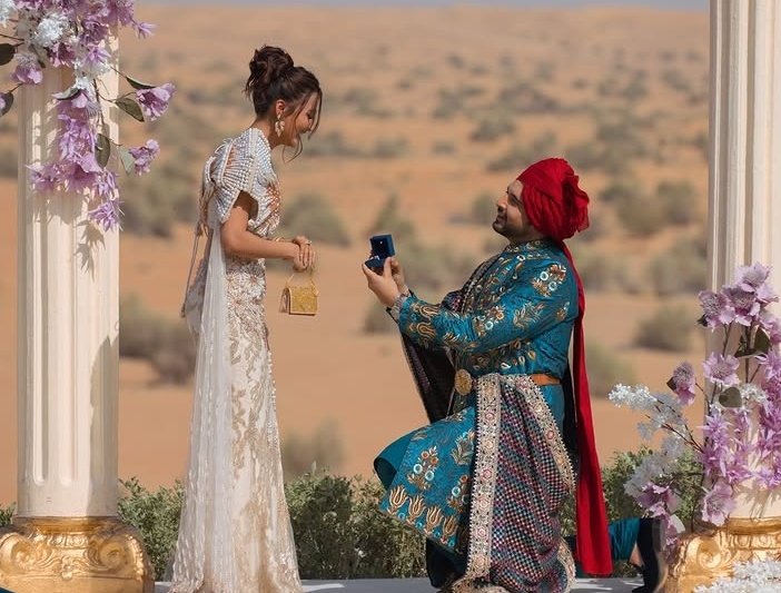 MindfulMoment19's tweet photo. In their first meeting ,they were talking about someone else’s proposal in LV  and even made them do the proposal  in front of them to now celebrating their own proposal together… what a full circle moment. 🧿
Congratulations to the  fiancés. It's official 🧿
#TejRan https://t.co/3zlrFpcd4p