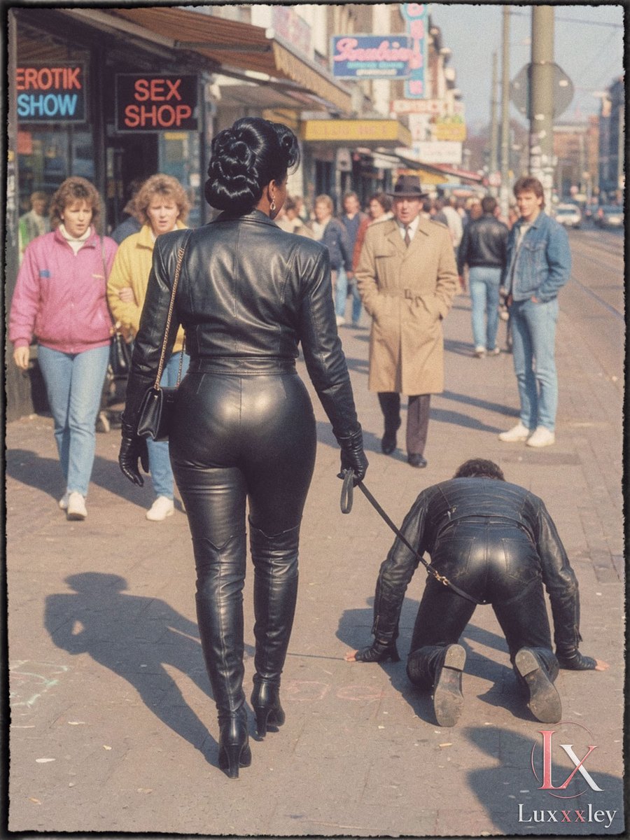 Luxxxley's tweet photo. Hamburg in the 80s: one of the first ebony leather mistresses takes her slave for a walk in public. 😍😈

#LeatherFetish #Leather #Matriarchy #Lady #FemaleSupremacy #Ebony #Mistress #Vintage #Retro https://t.co/EjYWmwGeeH
