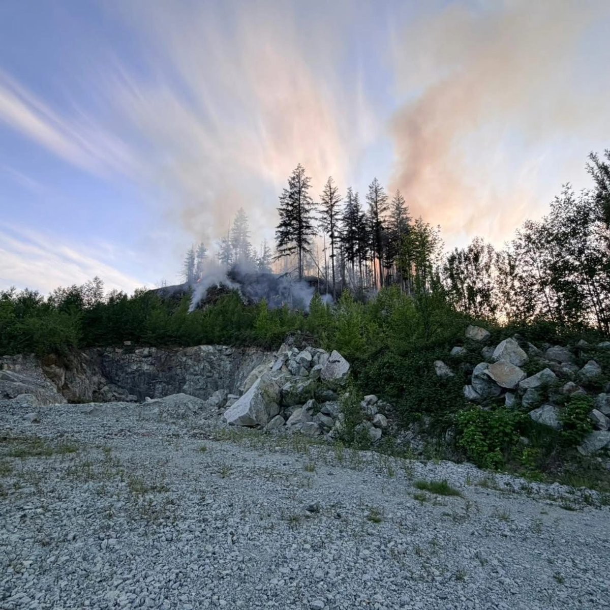YourMapleRidge's tweet photo. Rock Ridge Area Fire Update #3 (May 23, 9:15 AM)

Maple Ridge Fire & Rescue crews continue to respond to the fire located at the top of the Rock Ridge area along the interface of the Malcolm Knapp Research Forest. The fire, which started at approximately 6:30 PM yesterday evening, is currently estimated at 1.5 hectares in extremely steep and challenging terrain.

Approximately 25 personnel were on scene and into the early morning hours. Crews will continue active firefighting operations throughout the day.
 
Conditions remained stable overnight and weather conditions held as forecasted, assisting crews in preventing further fire escalation.

We continue to work closely with staff and equipment operators from the UBC Malcolm Knapp Research Forest. Additional support resources are also being coordinated with BC Wildfire Service fire crews to assist with fire suppression efforts this morning.

At this time, there is no risk to the public or nearby properties. There have been no reported injuries to the public or firefighters. 

Thank you to all crews who worked tirelessly throughout the evening and overnight to help protect our community.

The cause of the fire remains under investigation.

Smoke may continue to impact some residents in the area. Those sensitive to smoke are encouraged to keep windows and doors closed and limit outdoor exposure where possible.

Please continue to avoid the area for your safety and to prevent interference with firefighting and water shuttling activities. The public is also reminded to not operate drones anywhere near the fire area as they may interfere with aircraft operations supporting firefighting efforts. 

Updates will be provided as further information becomes available.

#MapleRidge #MapleRidgeFire
