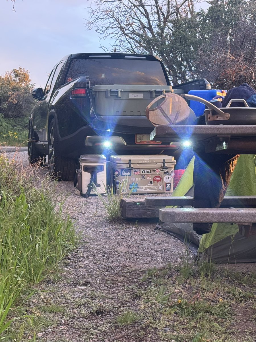 DellGarrett15's tweet photo. Feels like a good update idea to include control of the rear reverse lights in camping mode @Rivian @RJScaringe I noticed last night that after locking the truck that the leveled rear (coolest feature btw) lit up the surround area quite nicely until they timed out https://t.co/Cs8gs7FLwD