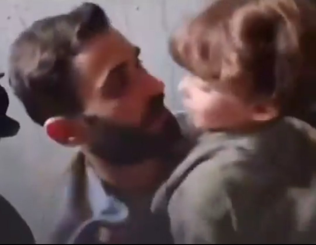 JC8Sanchez's tweet photo. @MisterJagger_ Screenshot of a Palestinian kid reuniting with his father after being freed by Israel. What is his skin and hair colour? https://t.co/YSbLIsIwtC
