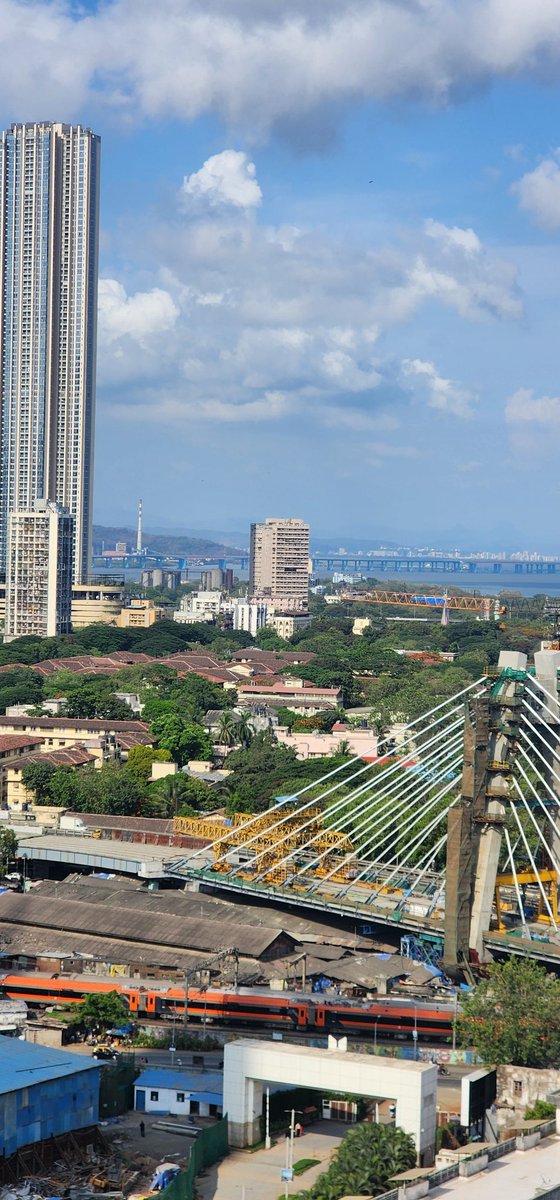 righteous_aadil's tweet photo. Skyscrapers, a cable-stayed bridge, Vande Bharat gliding through, Atal Setu stretching into the horizon, and a clear blue sky watching over it all.

This frame feels like the very soul of Mumbai 
forever under construction, forever in motion, yet endlessly alive.

#MumbaiRains https://t.co/HB2x6TMSvp