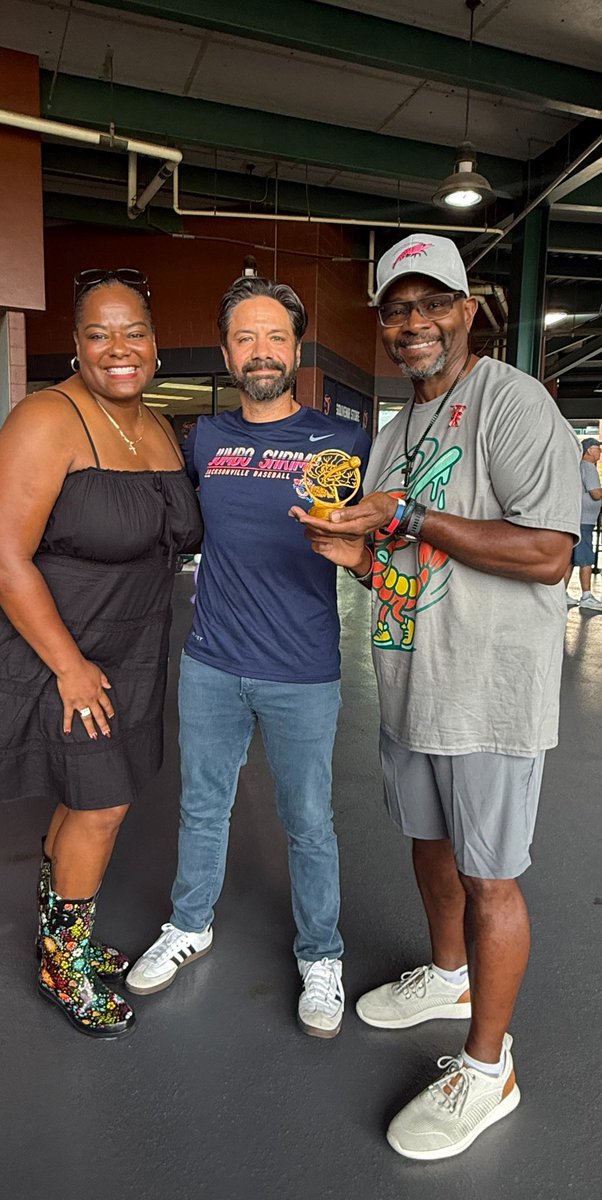 BaptistHealthJx's tweet photo. ⚾ 🏆 Tonight's MVP? Gregory Burton, former @DuvalSchools police chief, who took the mound to throw out the first pitch at the @JaxShrimp's Strike Out Stroke game.
After facing one of life’s toughest opponents - a stroke - Greg began his recovery journey at #BaptistJax under the expert care of neurointerventionalist Dr. Nima Amin Aghaebrahim and our dedicated stroke and rehab teams.
Greg was also presented with a special handcrafted “Stroke Champion” trophy designed and 3D-printed by Dr. Nima — a tribute to the determination, perseverance and hard work that have defined his recovery journey.
Today, Greg is back to playing golf, working out, running and enjoying life. Alongside his wife, Lakesha, he has become a passionate advocate for stroke and aphasia awareness, helping others understand the lasting impact stroke can have and the importance of seeking care quickly. While Greg has recovered physically, writing remains his primary form of communication as he continues therapy.
Greg was joined on the field by Lakesha, Dr. Nima and Wendy Camp, Baptist Health’s stroke program director, celebrating not only his recovery but the coordinated team approach that helps stroke patients receive life-saving care when every second counts.
Baptist Health’s stroke team was also at the game raising awareness about stroke prevention and warning signs, including sharing stroke risk assessment cards with fans.
His appearance on the mound was more than a ceremonial first pitch — it was a powerful reminder of resilience, recovery and the importance of recognizing stroke symptoms quickly. Every second matters when it comes to stroke care.
⚠️ Know the signs, and when stroke symptoms arise, call 911 immediately. Learn to BEFAST and help protect yourself and those around you: Balance. Eyes. Face. Arms. Speech. Time.
Take our stroke risk assessment and learn more about Baptist Health’s Stroke & Cerebrovascular Center at https://t.co/JqaHnmfzNL.