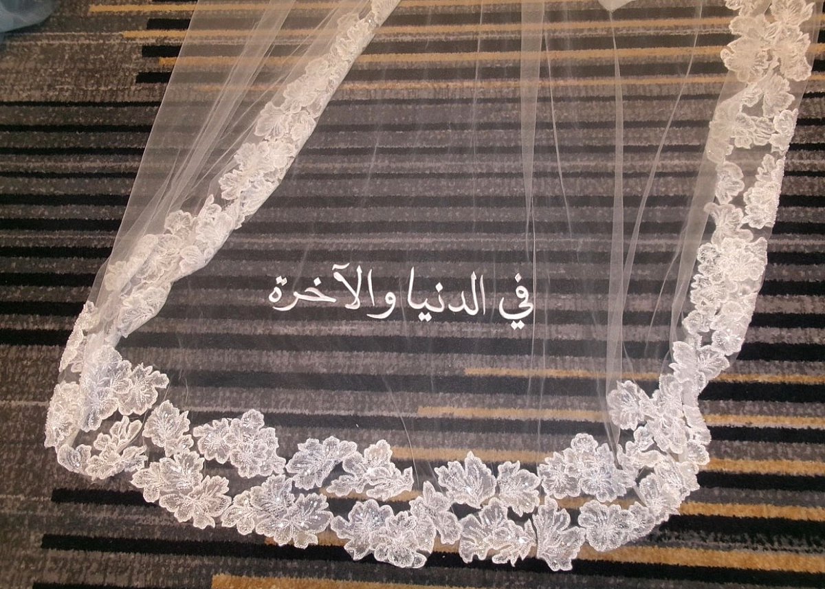 Al__Quraan's tweet photo. A wedding veil that reads ‘in this life and the next’. https://t.co/JbpIj9gv0W