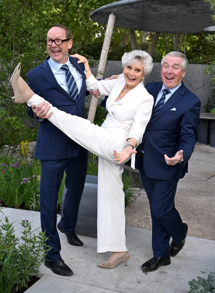 eric_ern's tweet photo. @EricIdle One lucky Bastard!! Hugs from over the pond! X Congrats to you and Tanya too. Though this would make you smile. 
Us with Angela Rippon!! https://t.co/X0c50kXcUi