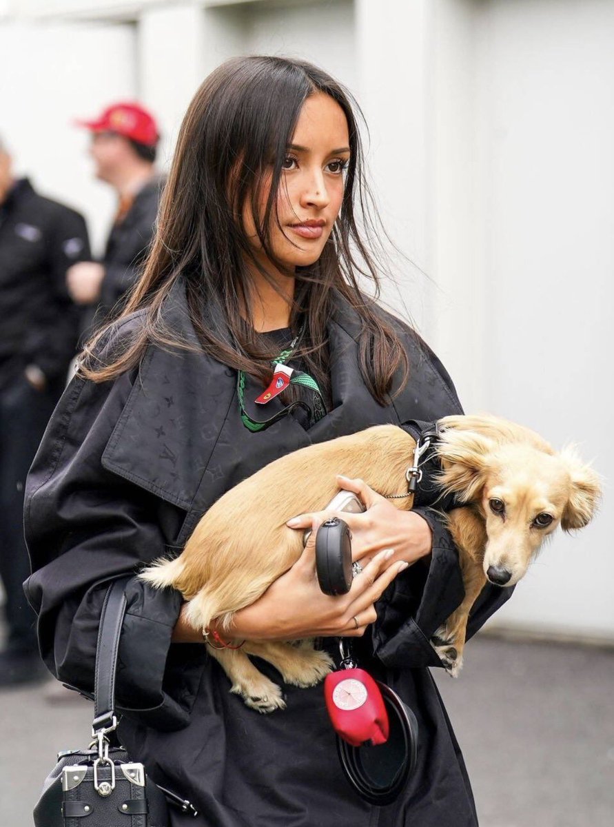 arexandra's tweet photo. Dark hair dances softly in the breeze while her little golden companion rests secure in her arms, two souls perfectly in tune. Tenderness wrapped in strength a beautiful harmony of fierce independence and quiet, unconditional love. https://t.co/h2aev5DxXy